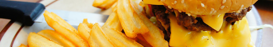 Eating Burger at Jiffy Burger restaurant in Smith Center, KS.
